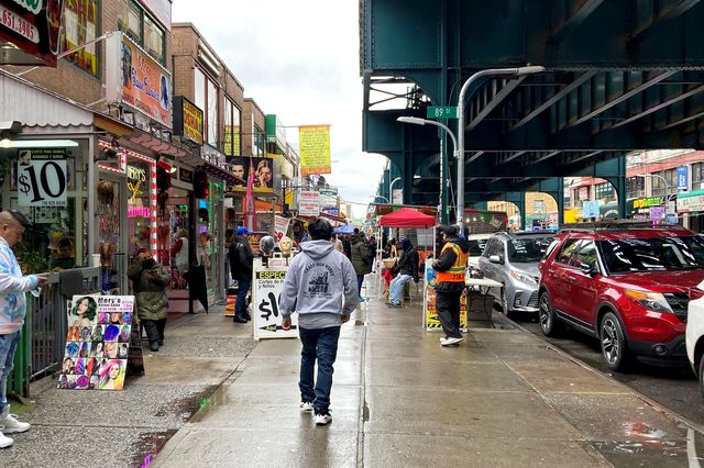 a busy block in Jackson Heights
